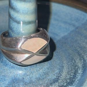 Large sterling silver ring with mother of pearl inlay.